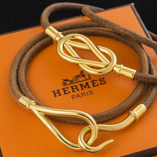 Bracciali pelle e metallo dorato serie "Jumbo" di Hermès